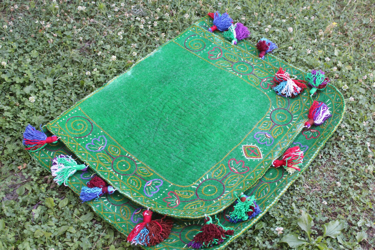 Green felt Shabrak with embroidered border and pompoms