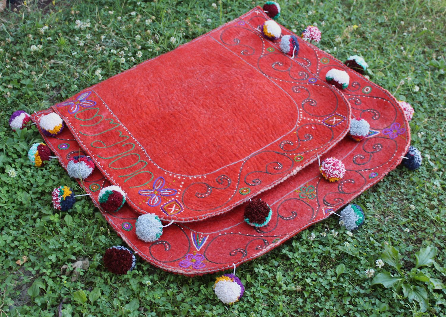 Red felt Shabrak with embroidered border and pompoms